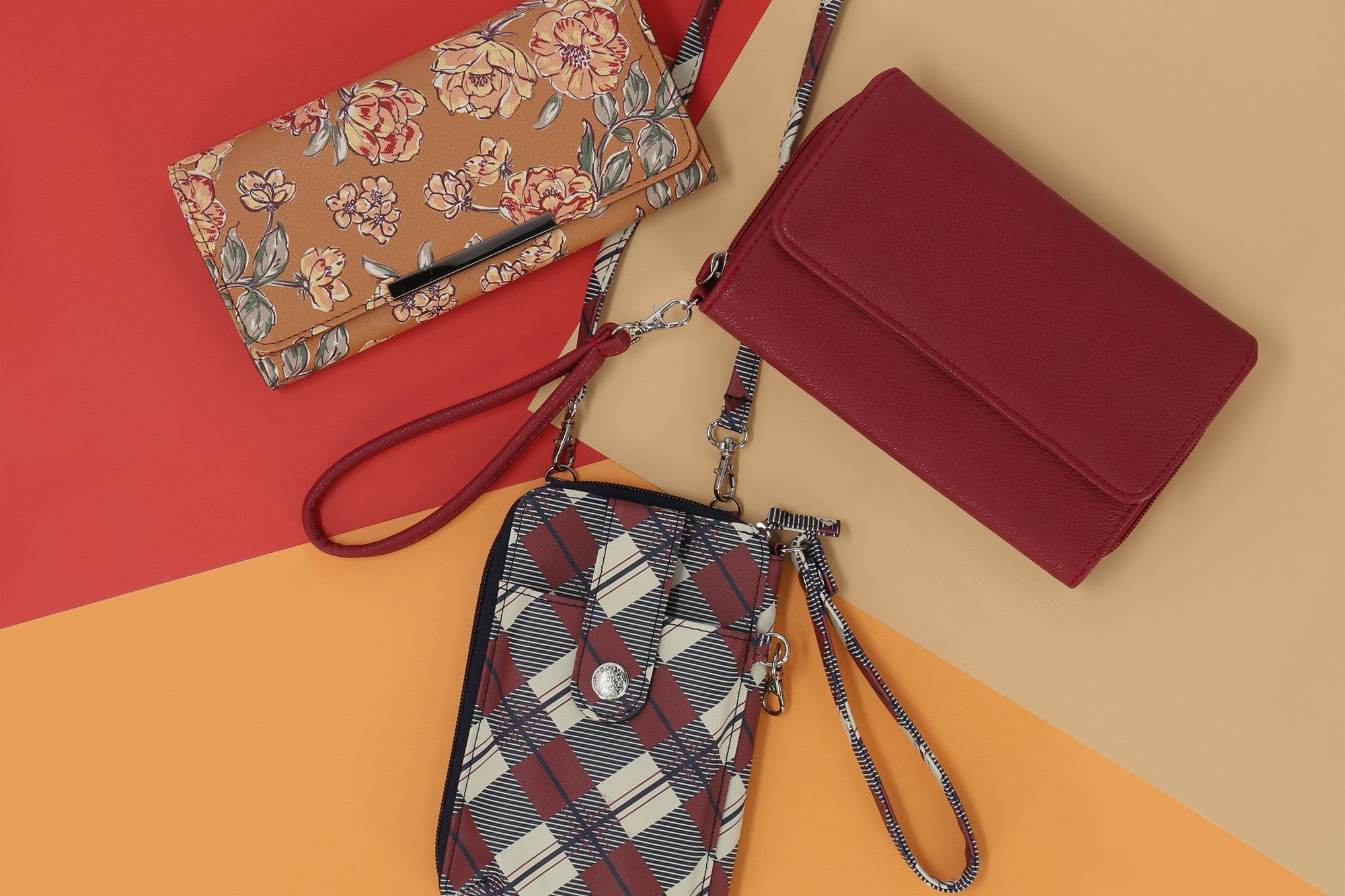 Sustainable Gifts under $20 - Showcased in this image is our Jacqui phone wallet, Big Fat Wallet, and File Master Clutch lying on a table in a circular formation. All of these wallets are sustainable and made with recycled interior liners.
